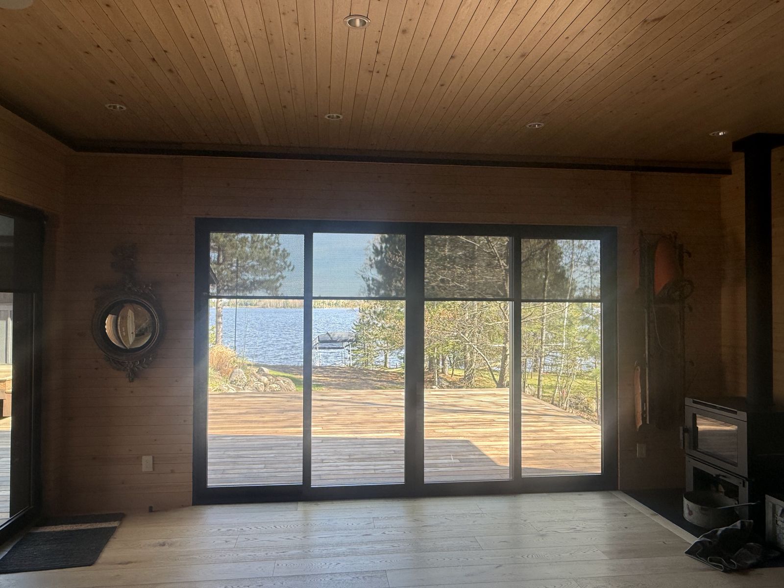 Bedroom with sliding glass doors opening toward the lake
